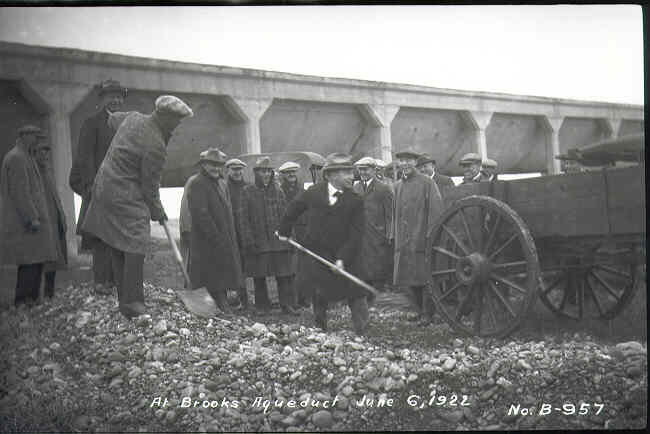 Cold Guys digging dirt in February next to the Aqueduct
